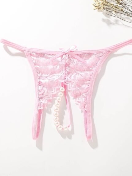 Pink lace pearl crotchless panty flat lay product image