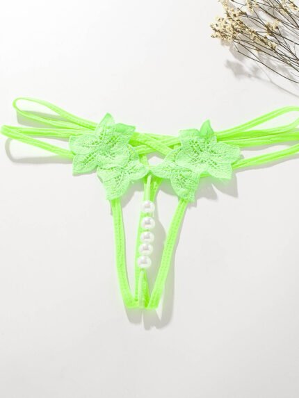 Green floral lace pearl open crotch strappy thong panty flat lay