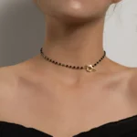 Elegant Black Beaded Choker Necklace with Gold Floral Pendant